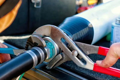 Technician tightening an industrial pipe connection in Bradenton