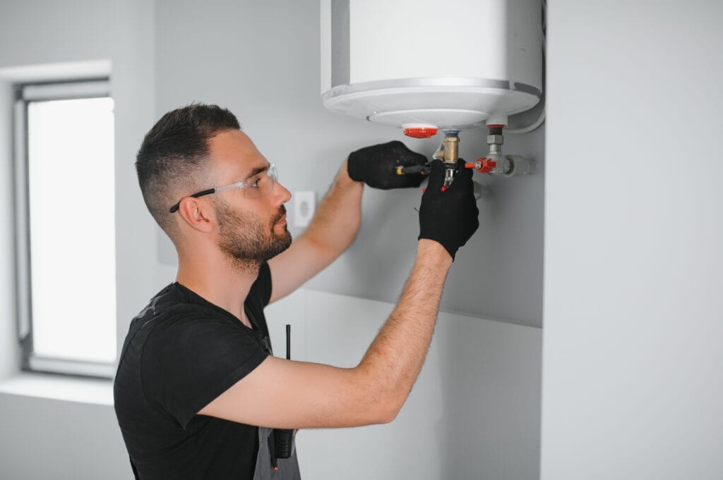 Technician performing water heater maintenance in Bradenton